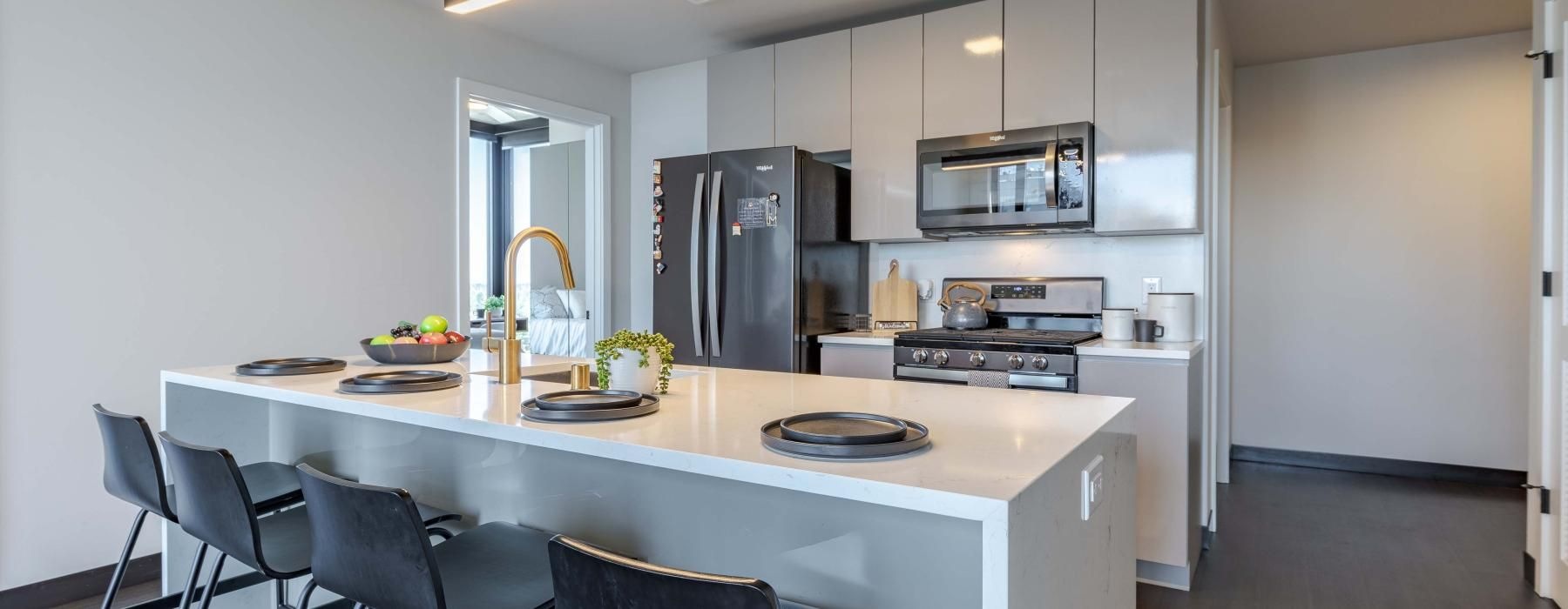 a kitchen with a marble island