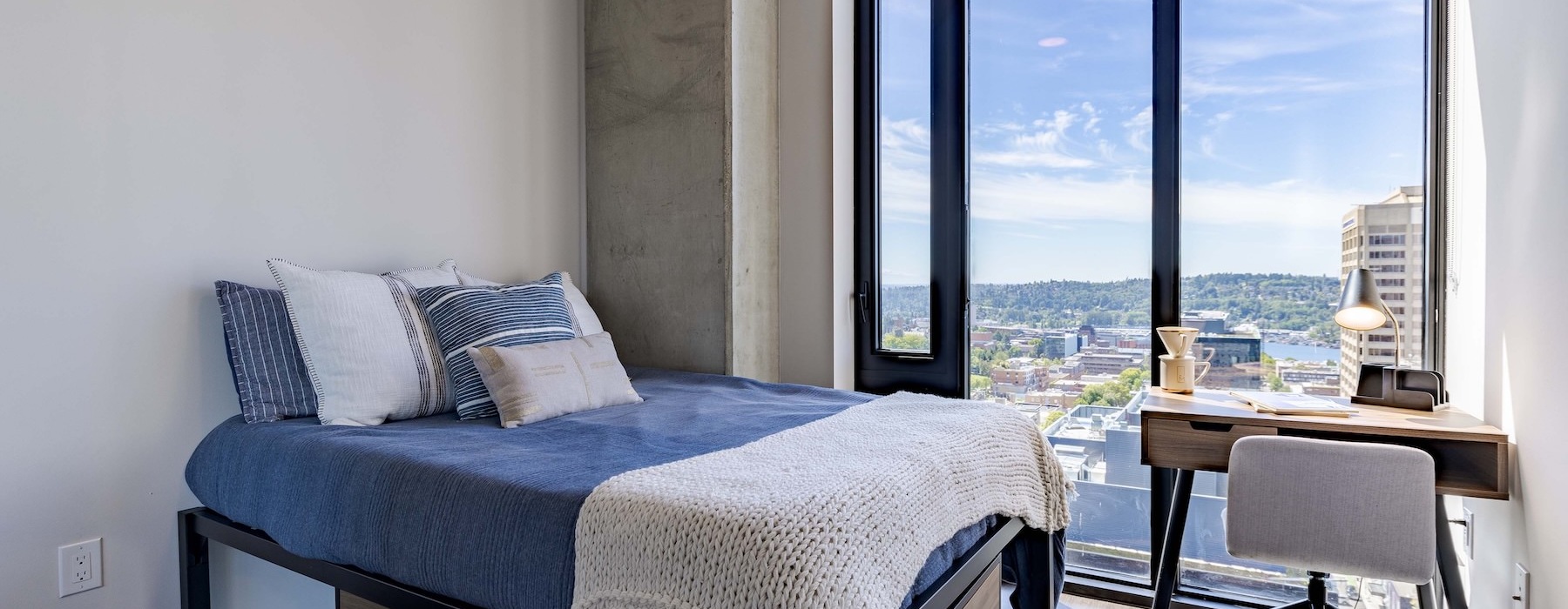 a bedroom with a bed and desk