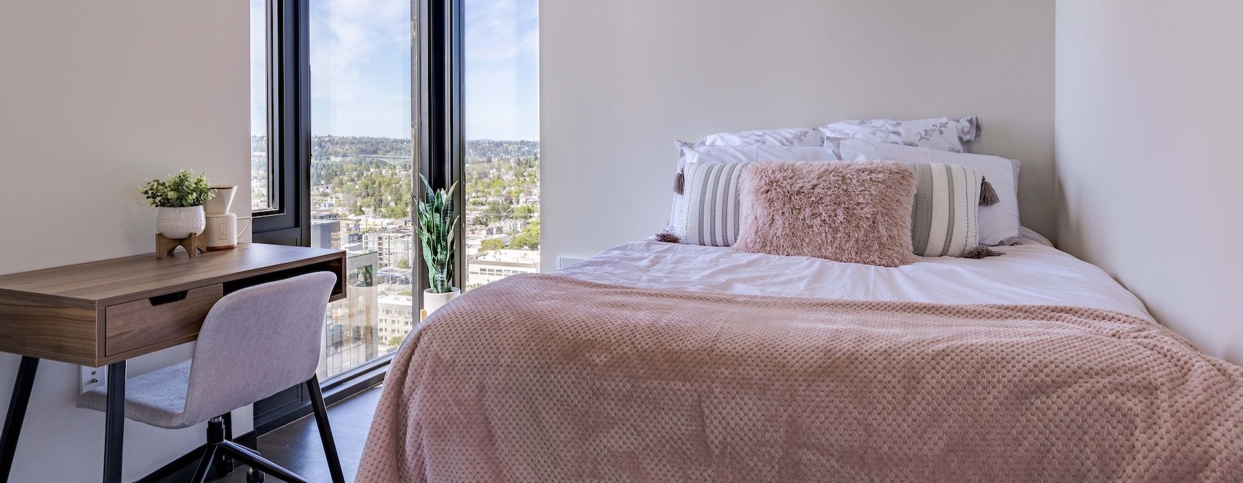a bedroom with a bed and a table
