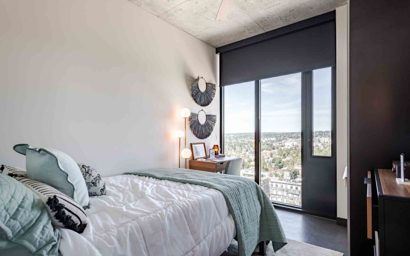 a bedroom with a bed and desk